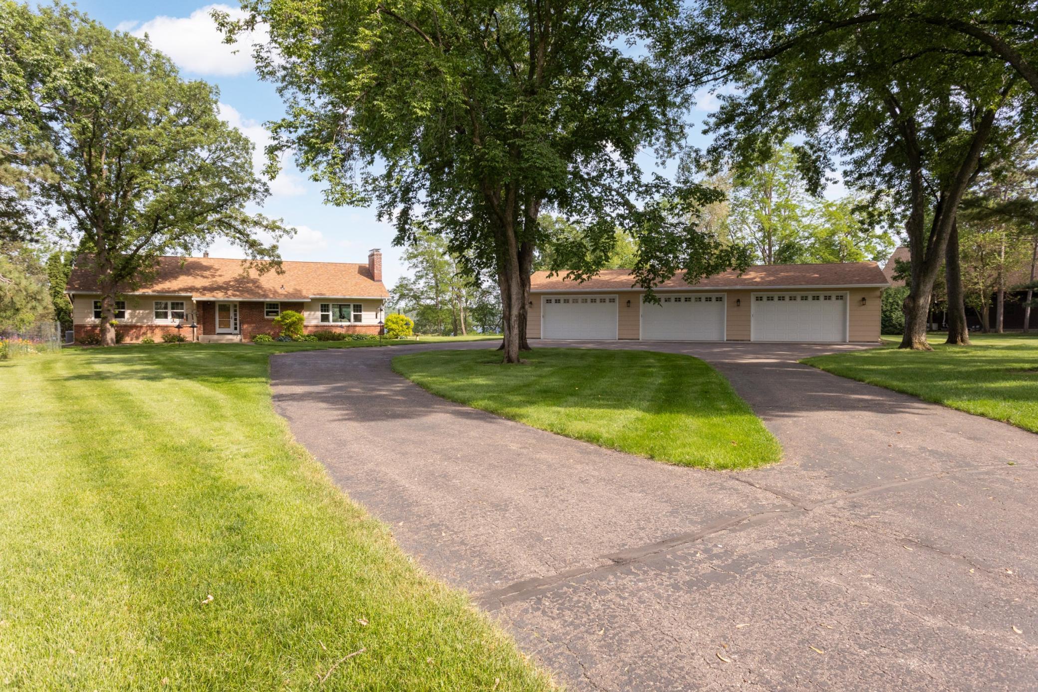 Circular driveway for lots of parking and easy entry into the 6-car garage.