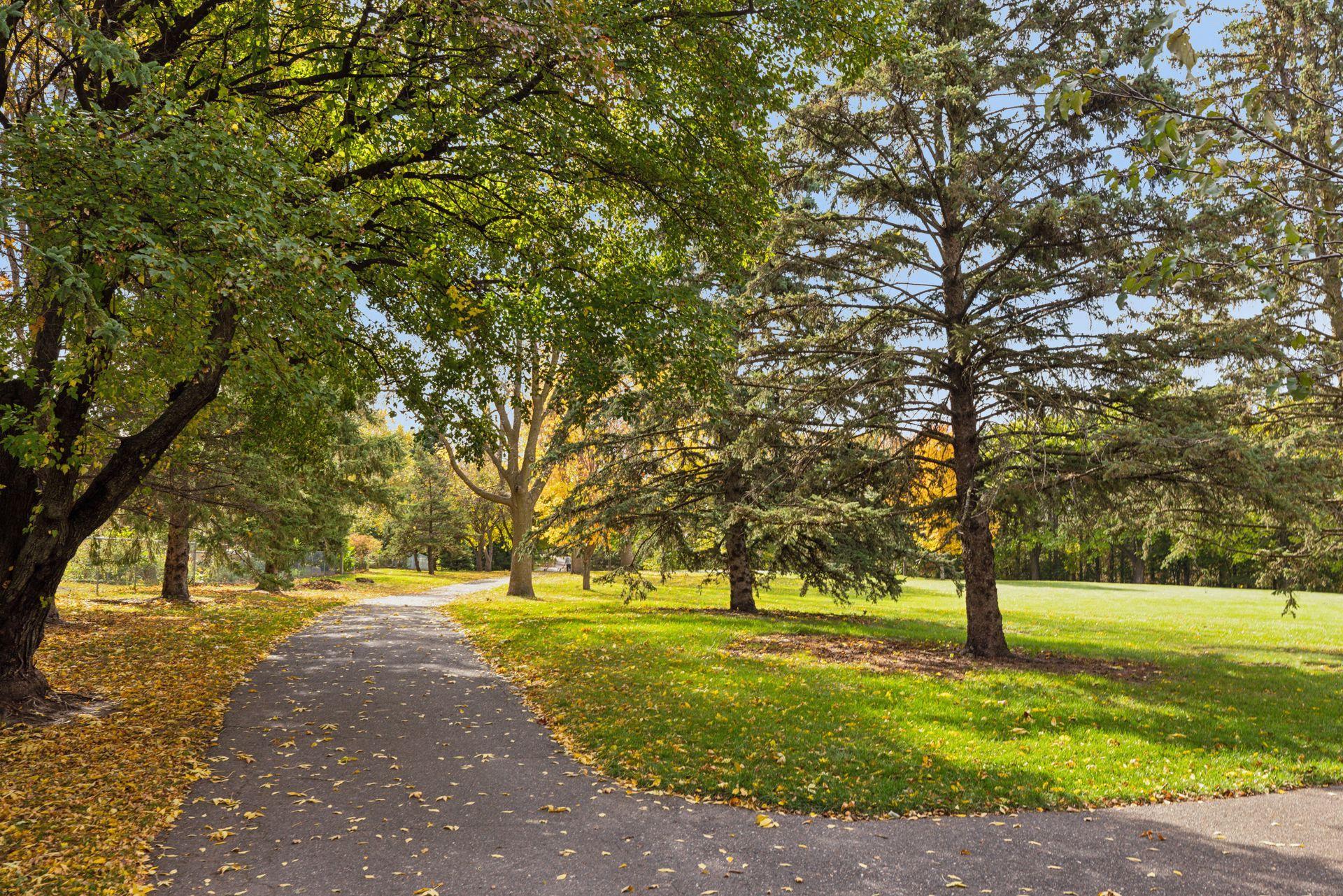 Scenic walking paths wind throughout the nearby park.
