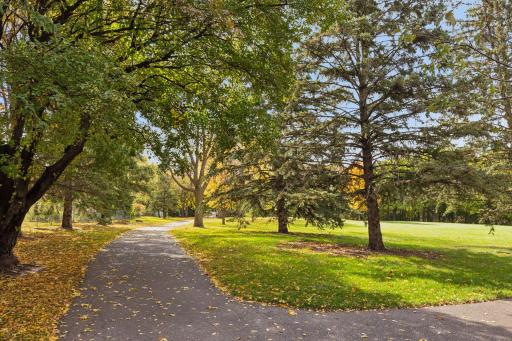 Scenic walking paths wind throughout the nearby park.