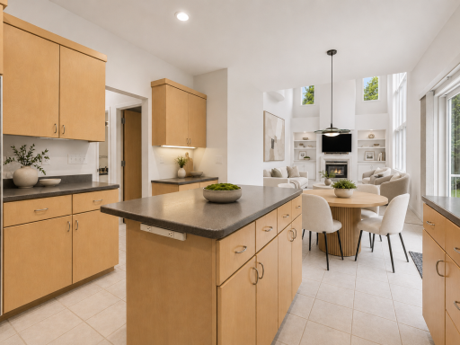Virtually removed wallpaper and painted with virtually staged kitchen and Great Room. Beautiful open concept floor plan.