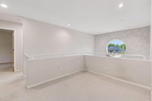 Spacious loft makes ideal study area or second office.