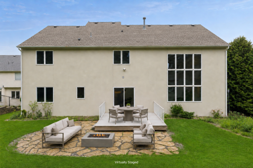 Virtually staged patio. Low maintenance composite decking and beautiful stone patio.