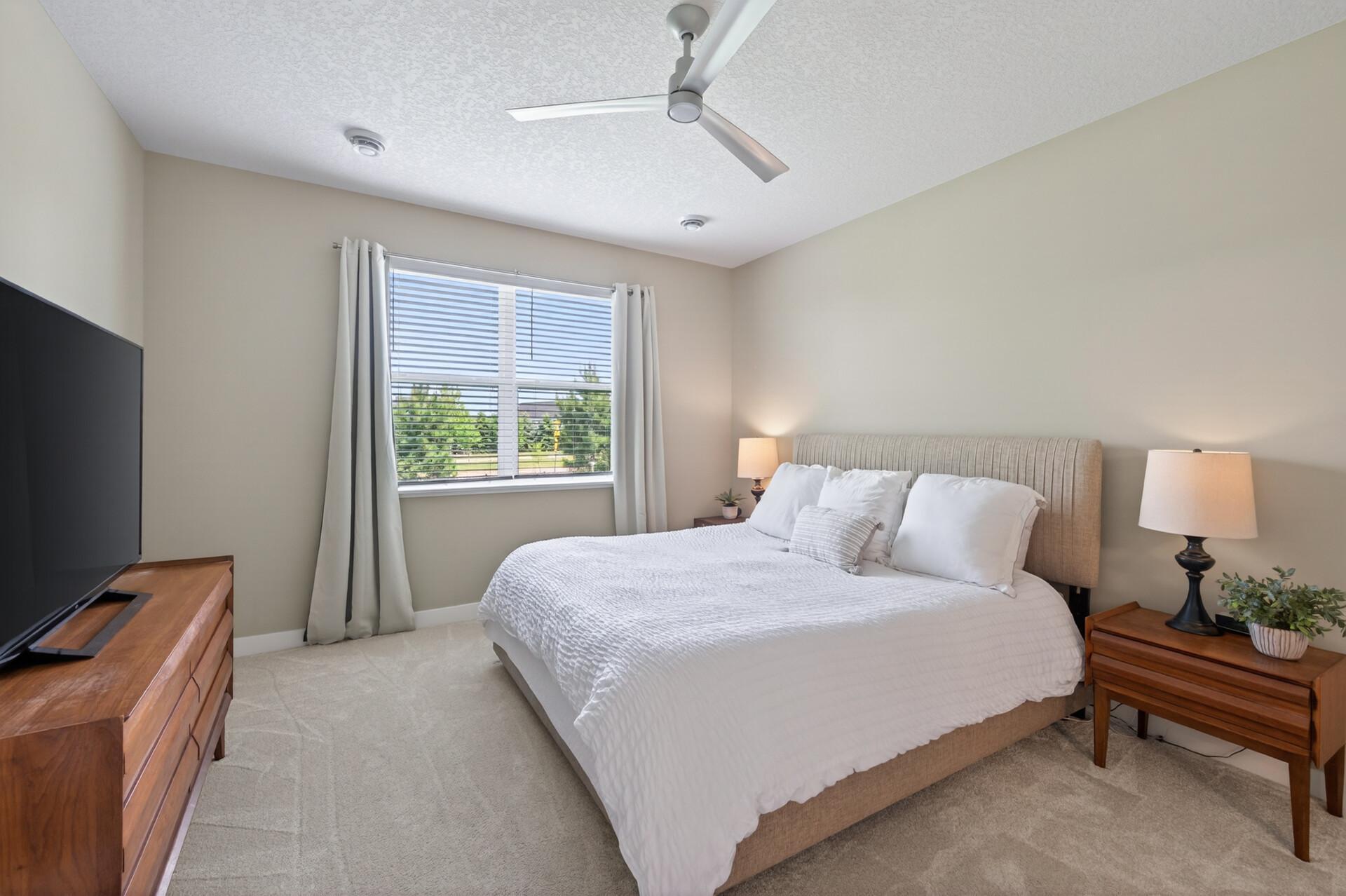 Private primary suite with en-suite bathroom and walk-in closet. You will love that the guest suite is in the front side of the home for extra privacy.