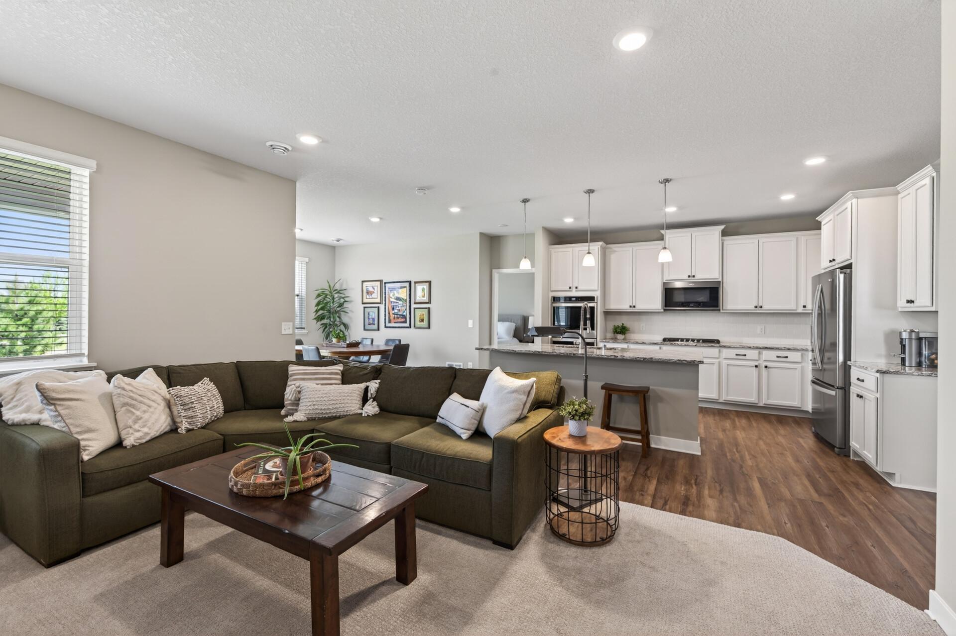 The perfect open concept floor plan for enjoying the tv from the kitchen or entertaining guests at home.