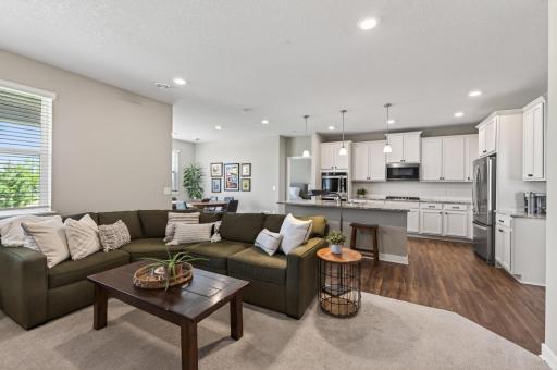 The perfect open concept floor plan for enjoying the tv from the kitchen or entertaining guests at home.