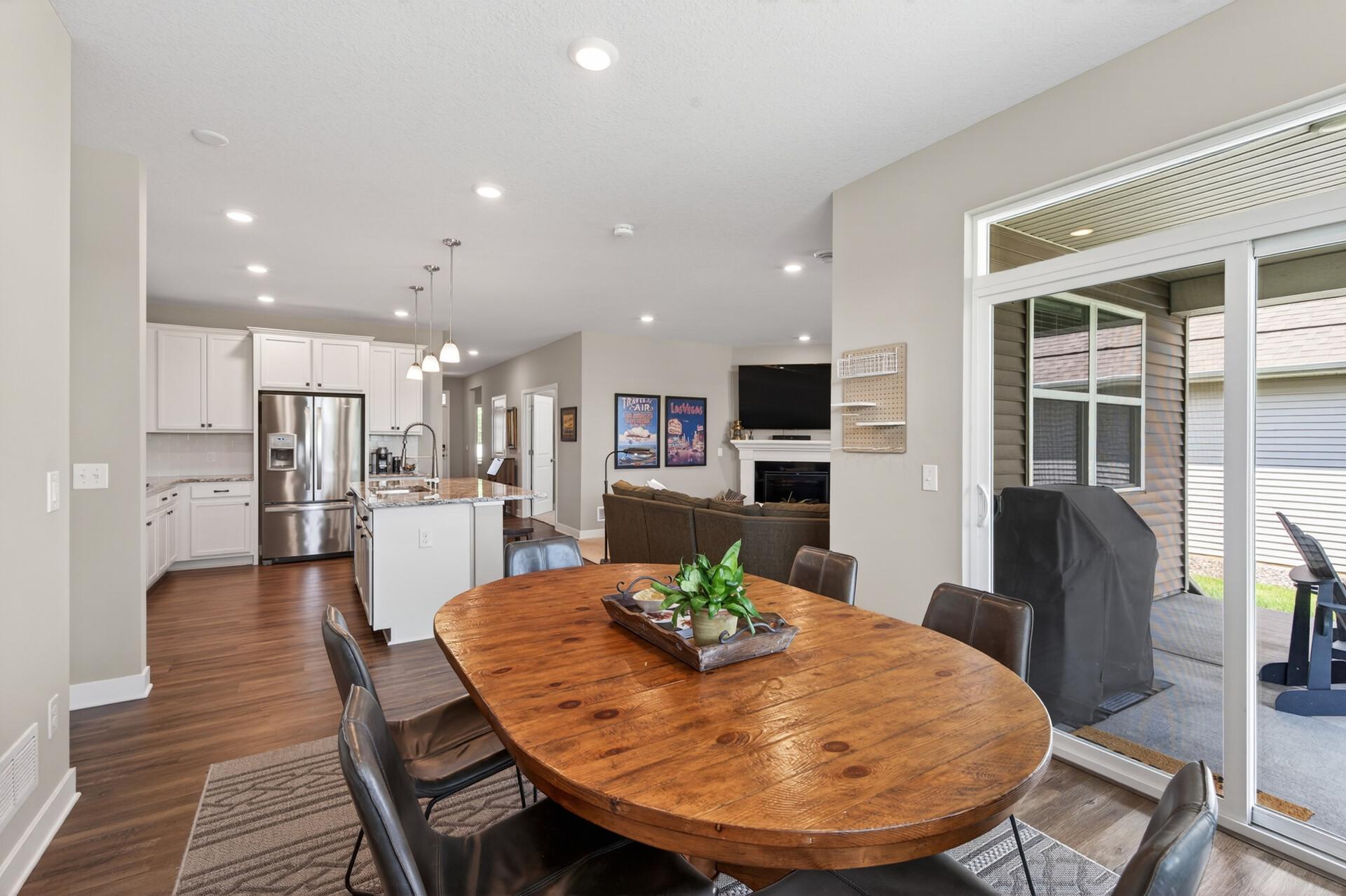 View from the living room. Look at those gleaming laminate floors, everything is beautiful and pristine in this home. This home will not disappoint!