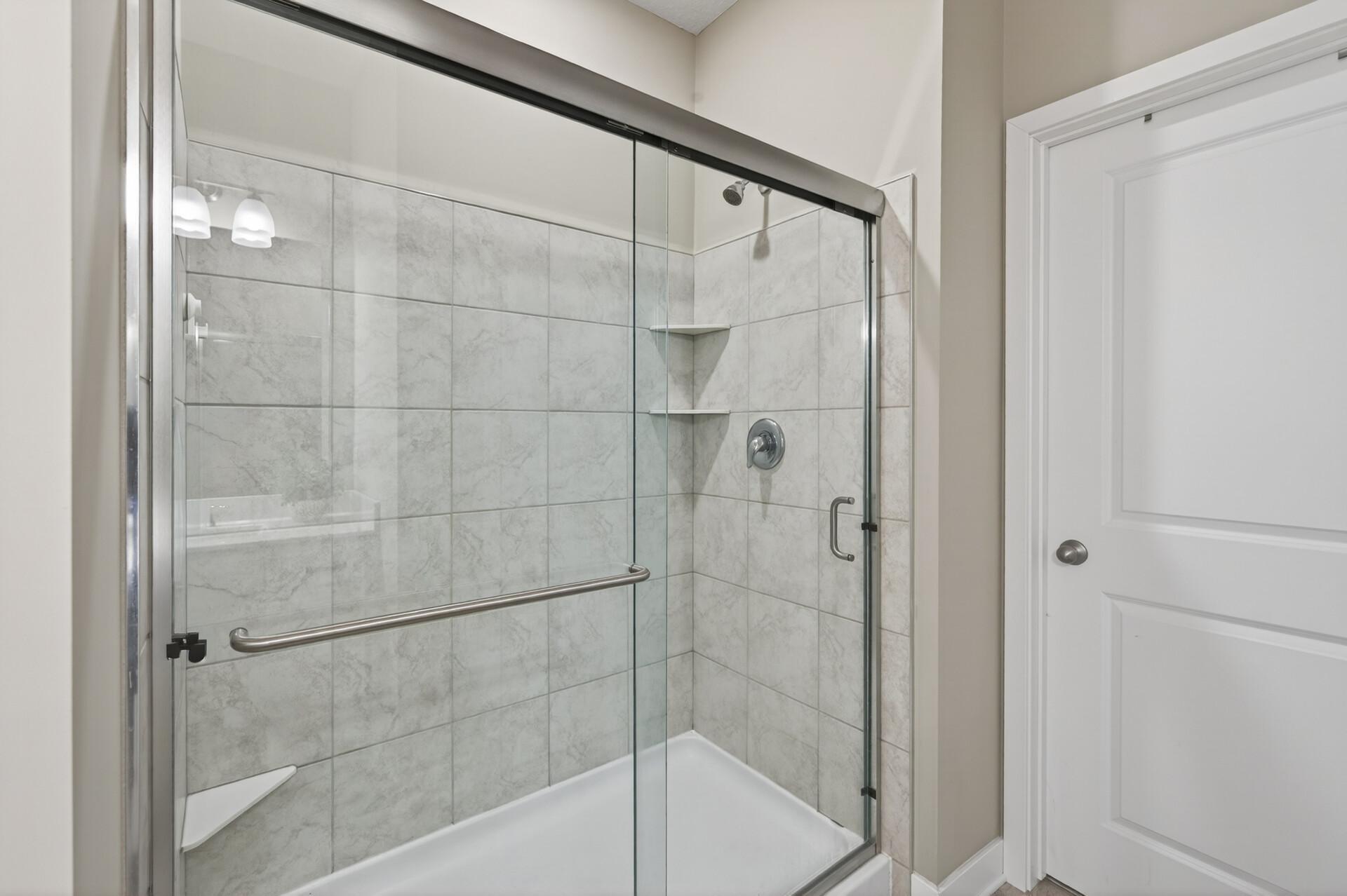 Spa-like shower with pristine tile surround.
