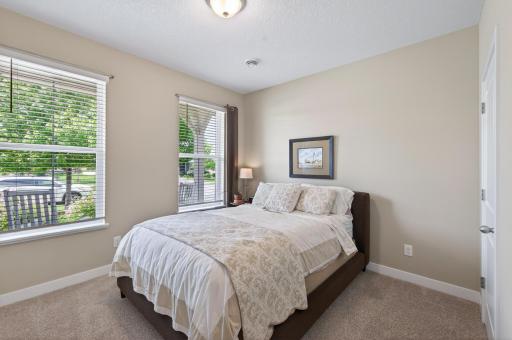 2nd bedroom on the main-level with large closet. You will love that the guest suite is in the front of the home for extra privacy from your primary suite.