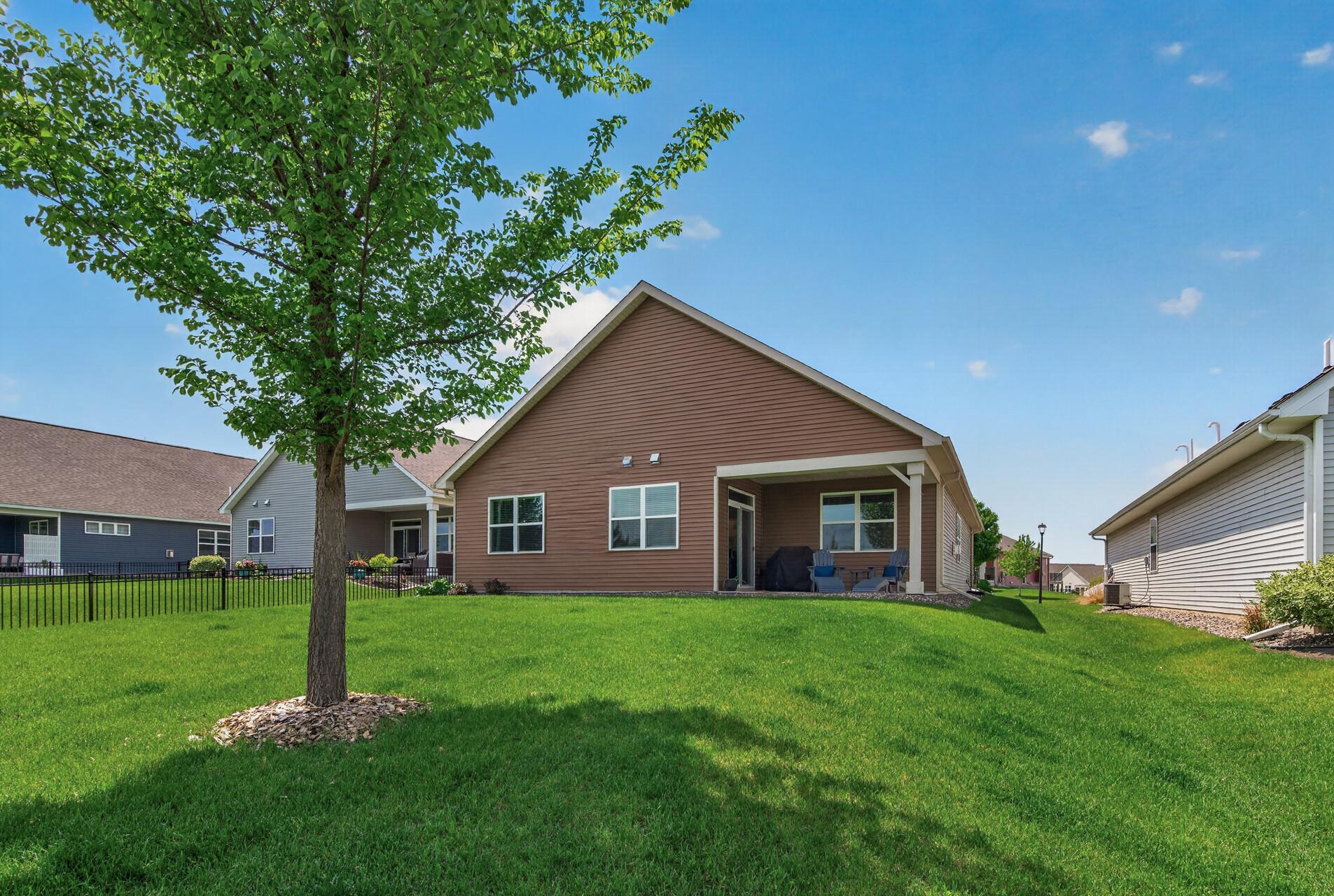 Look at that yard space that is cared for by the HOA! There are lots of sunny spots if you seek to add a HOA approved garden. Or keep to pots and make your life a bit easier! Sprinkler system included!