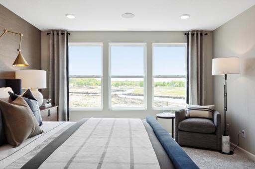 Windows on the back wall of the primary suite