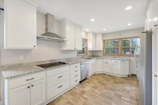 Newer flooring, cabinets, countertops and stainless steel appliances