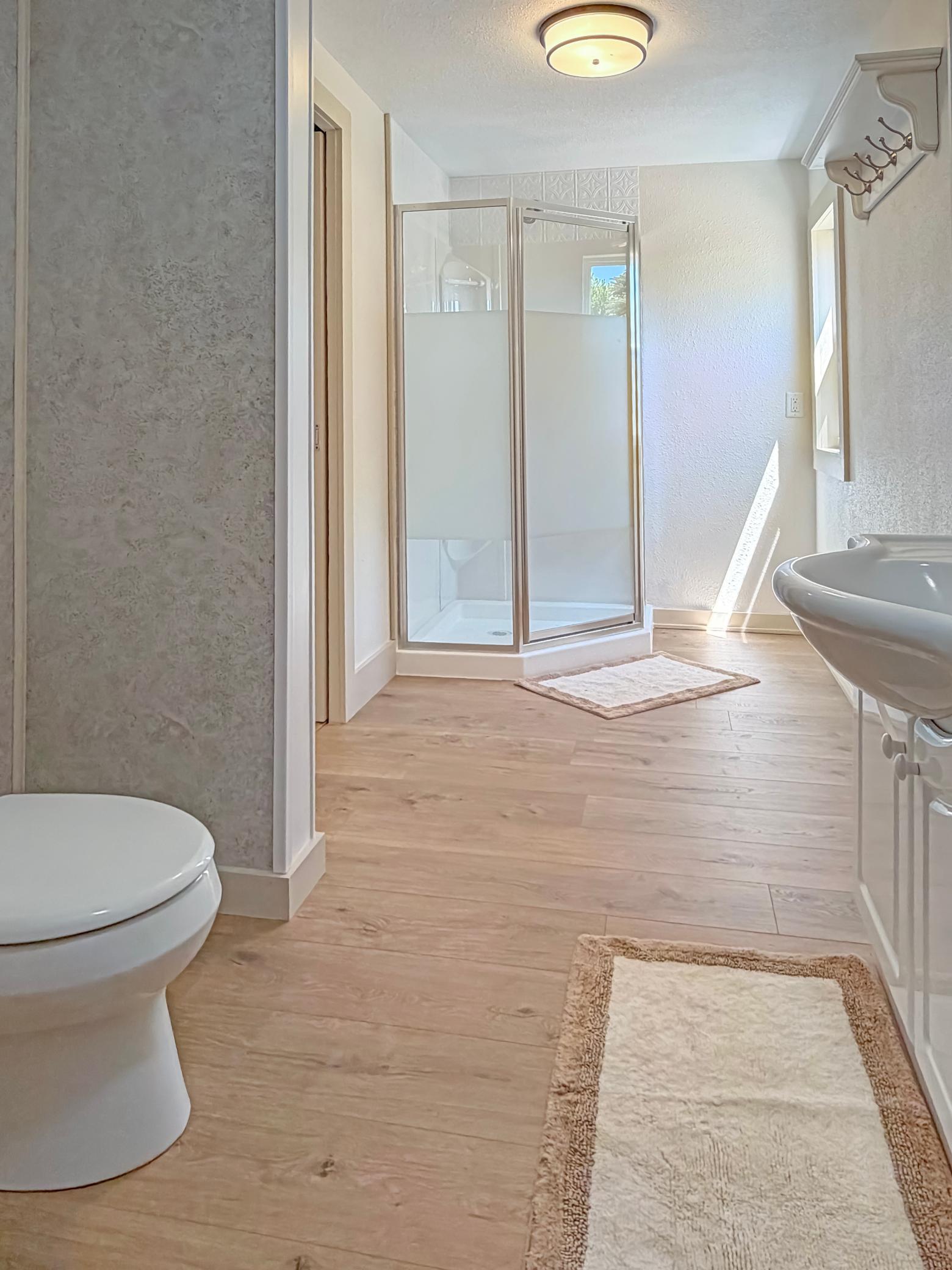 Back on the main floor we find a remodeled 3/4 bathroom