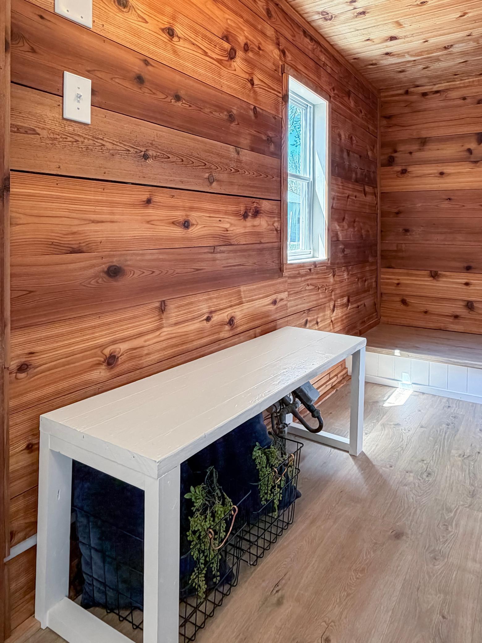 Wooden wall boards give it a rustic touch