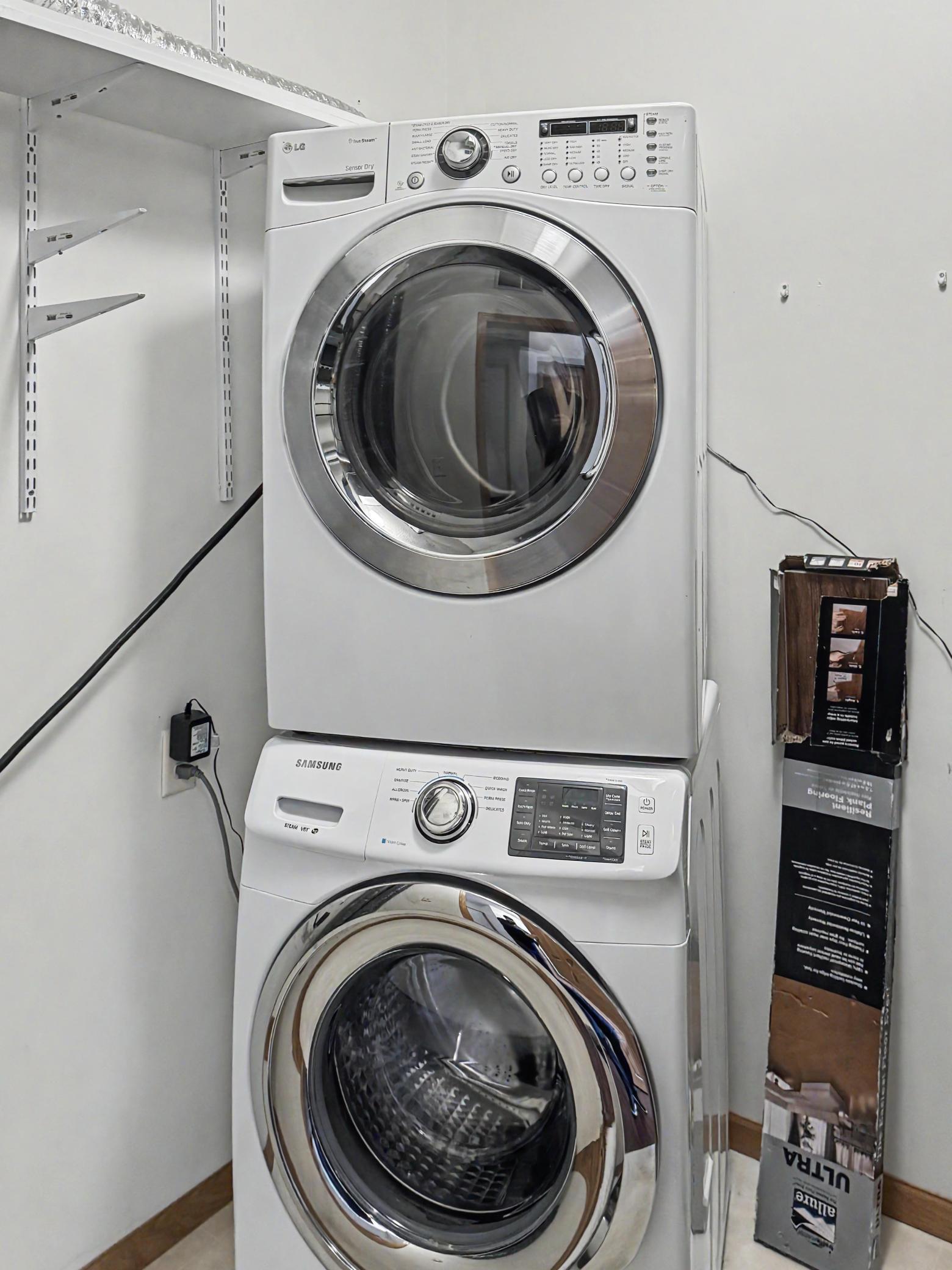 Stacked front loading washer and dryer