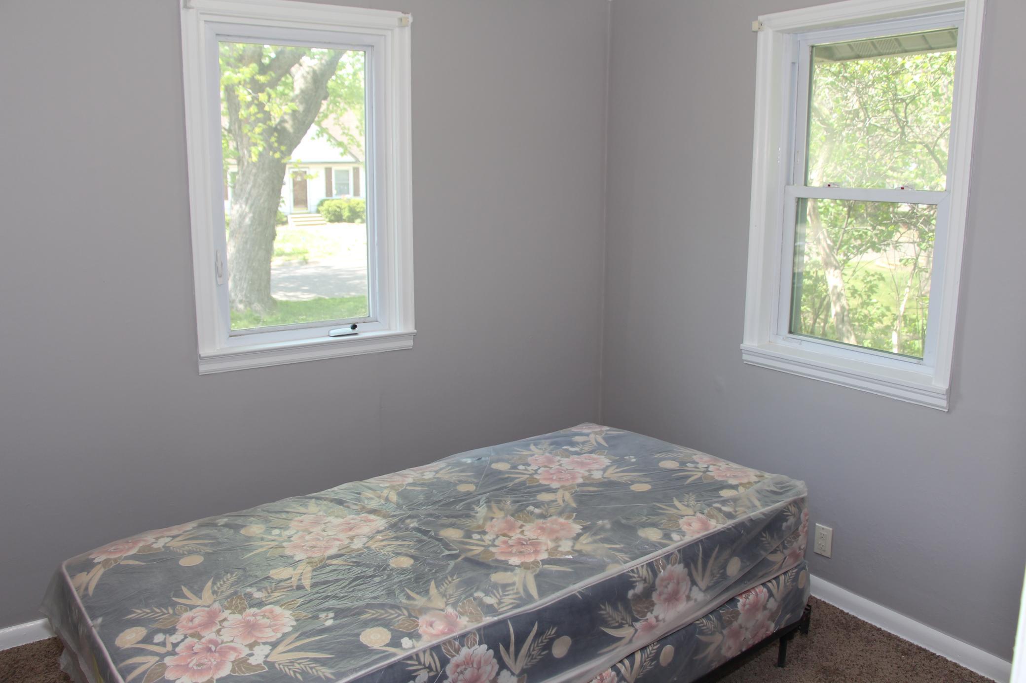 This is the second bedroom on the main level, also featuring newer carpeting and two new windows.