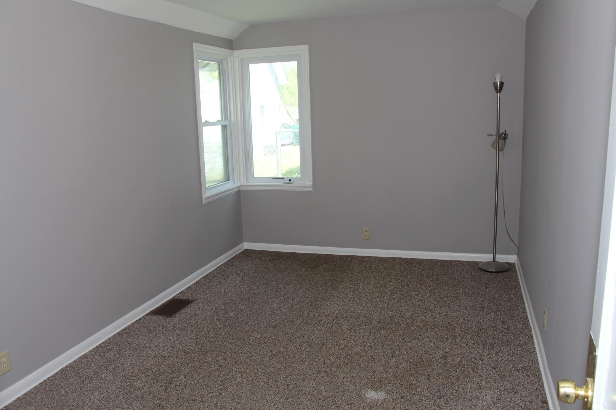 This is the Master Bedroom on the main level, which features two corner windows.