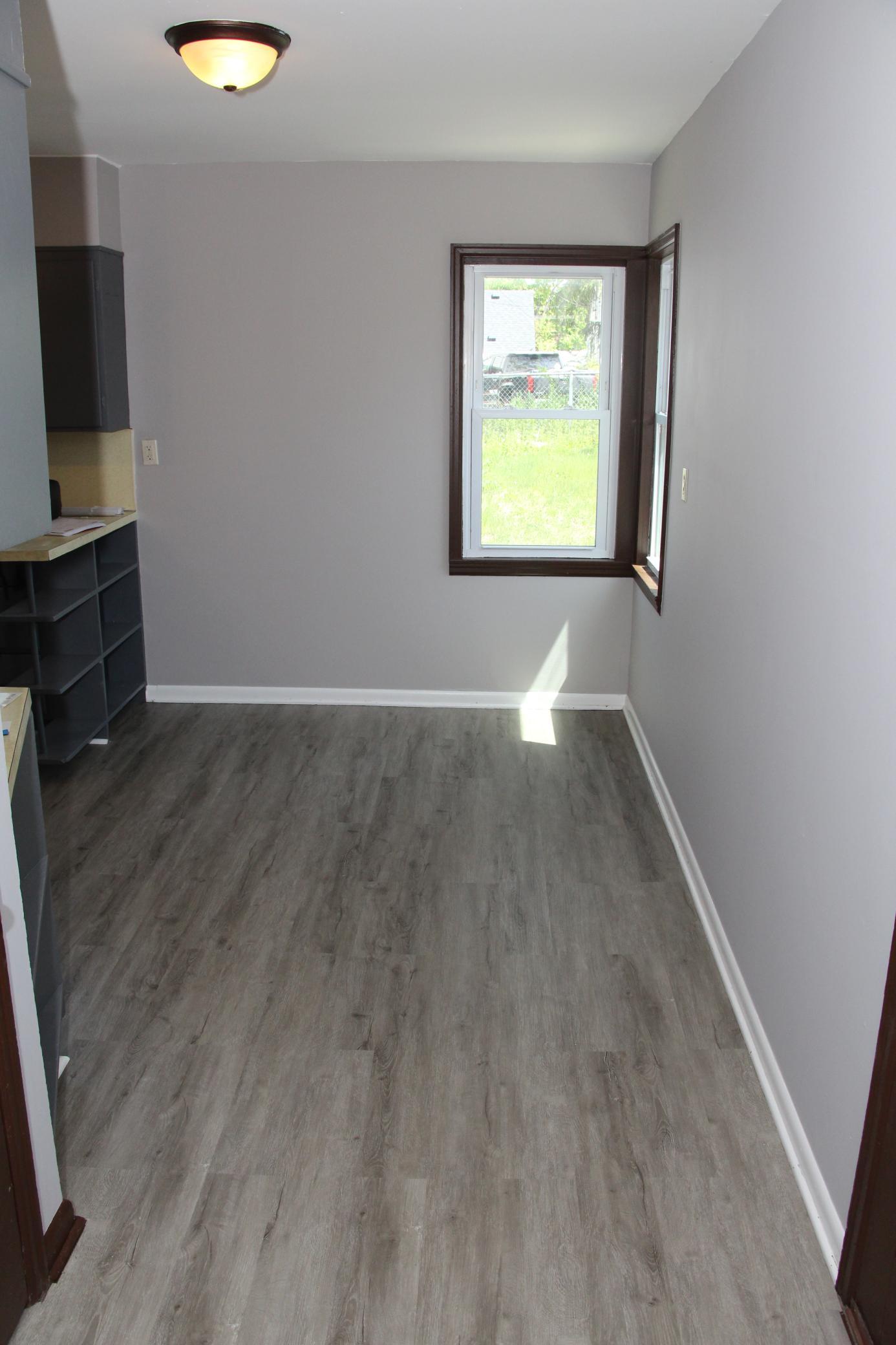 The informal Dining Room features newer flooring and windows and plenty of room for a large DR table.