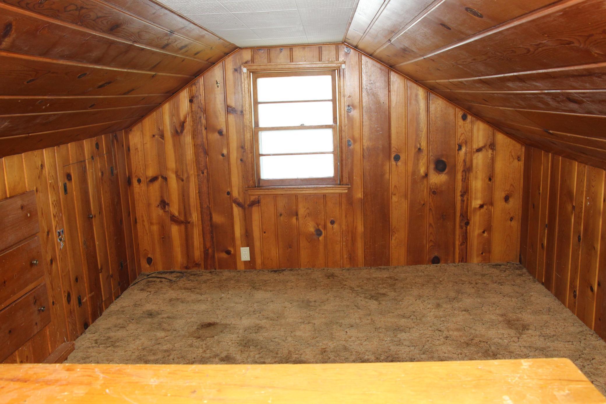 This is the fourth bedroom in the upper level. All gorgeous cedar/pine and LOTS of storage in the closets and some built in drawers, too!