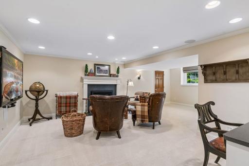 Lower level recreation room with 3rd fireplace