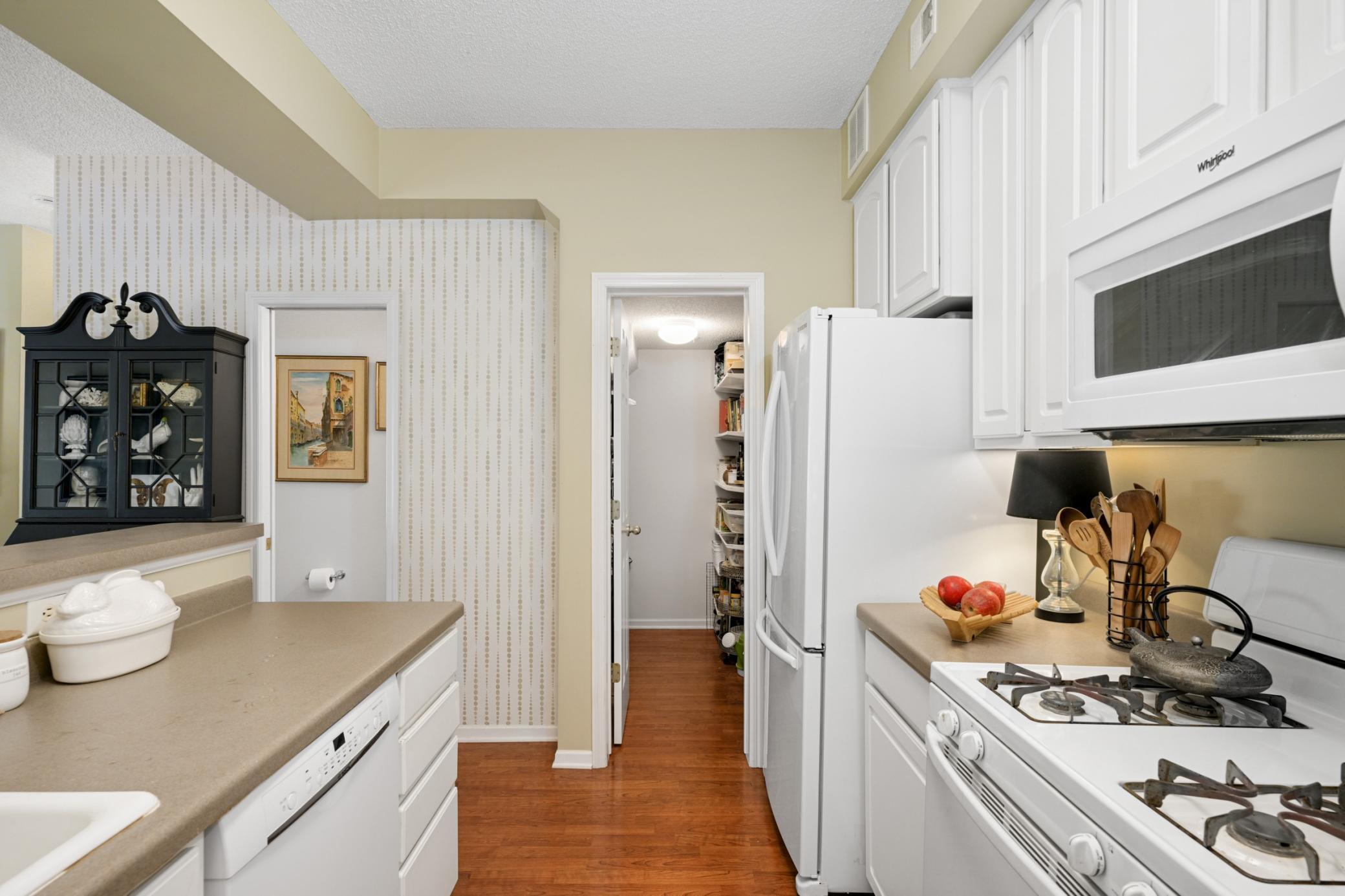 Amazing walk-in pantry - outfitted with shelves, drawers, & magnetic spice organizer.
