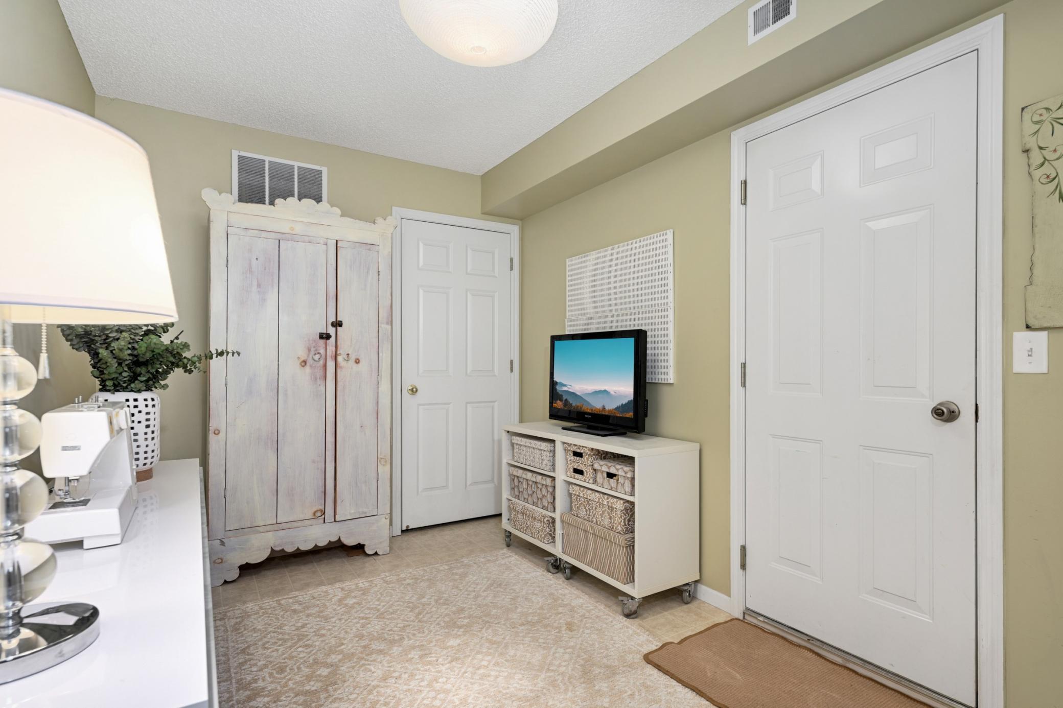 Lower level office/hobby room with access to the attached private garage.