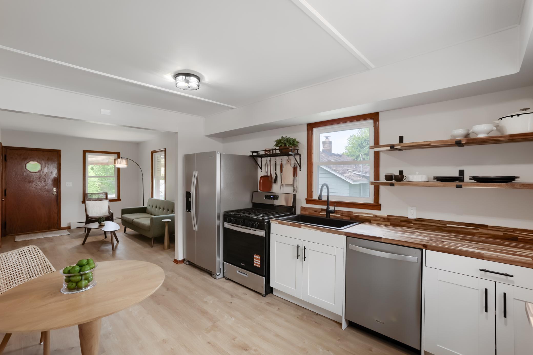 The kitchen is fully remodeled with new appliances, cabinets, countertops and sink.