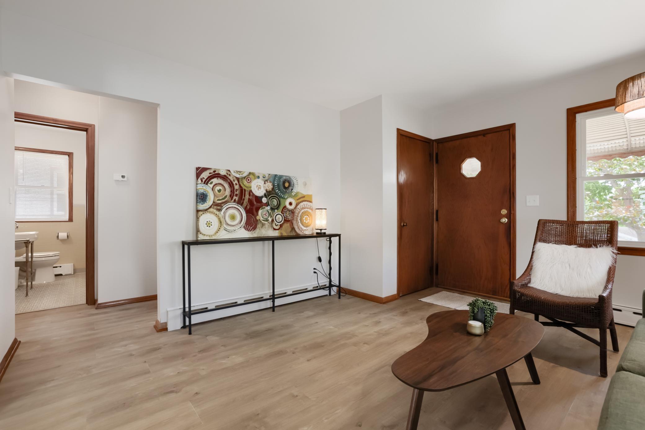The living room has plenty of room for additional seating or a large screen TV.