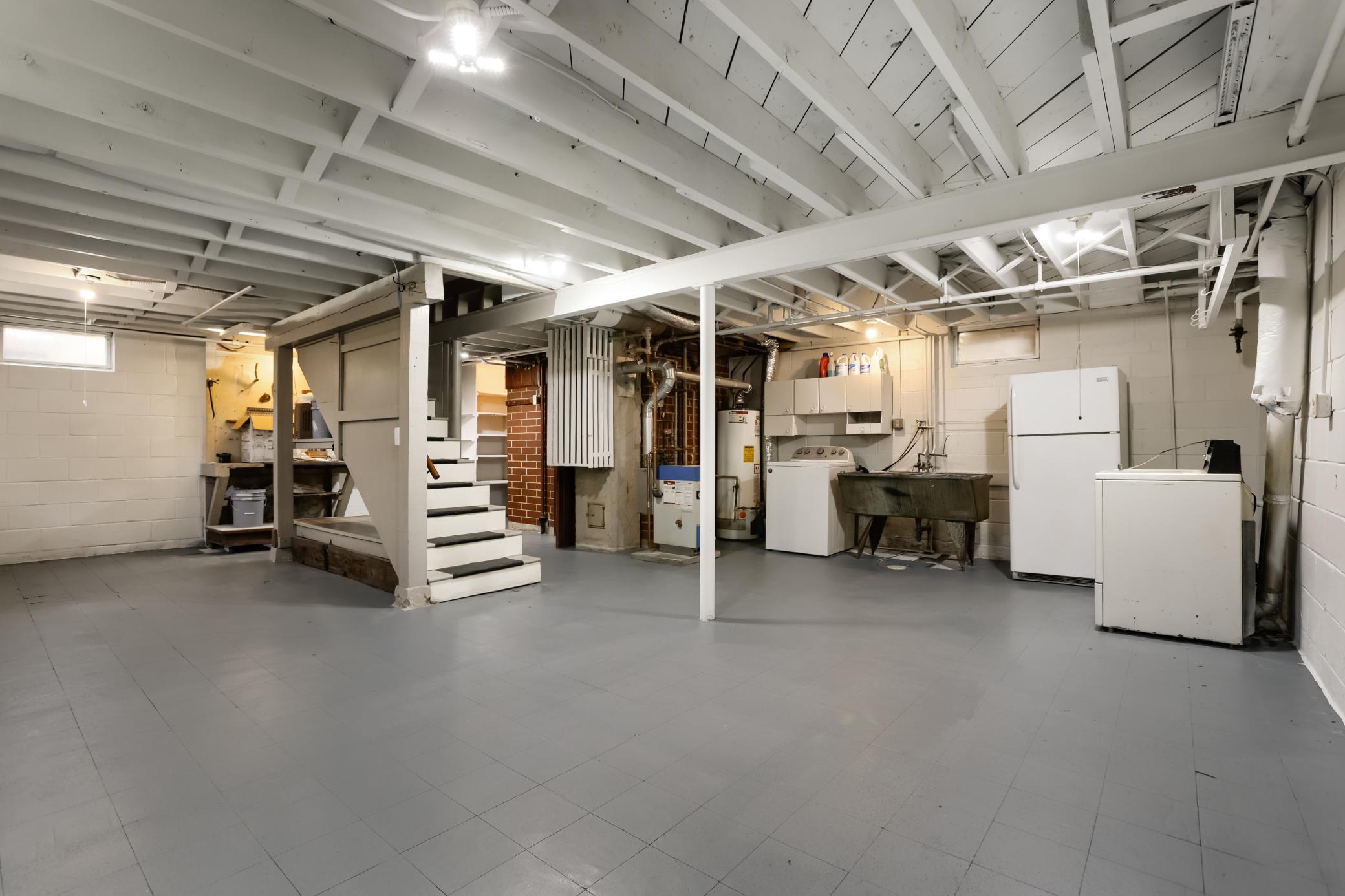 The lower level is freshly painted and offers high ceilings. Finish this area, or just use it as it is. Endless options for more square footage.