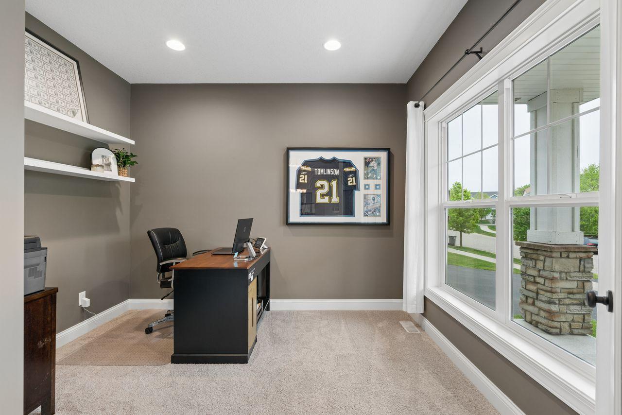 Just off the front entryway, the sunny den offers a convenient home office or extra living space.