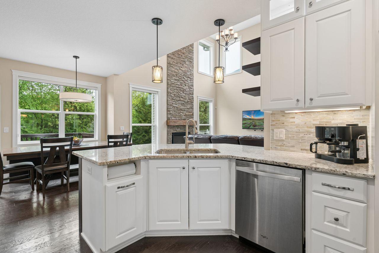 The heart of the home- the kitchen is perfect for entertaining. It's central location offering a breakfast bar, lots of counter space (granite), and soft close drawers make hosting a breeze.