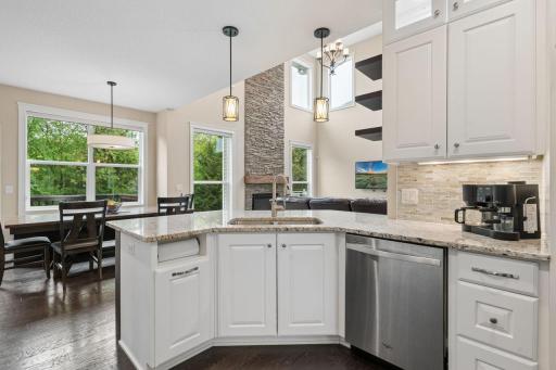 The heart of the home- the kitchen is perfect for entertaining. It's central location offering a breakfast bar, lots of counter space (granite), and soft close drawers make hosting a breeze.