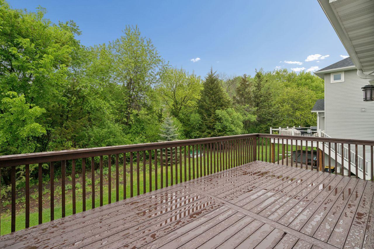 Private deck overlooking your tree-lined backyard.