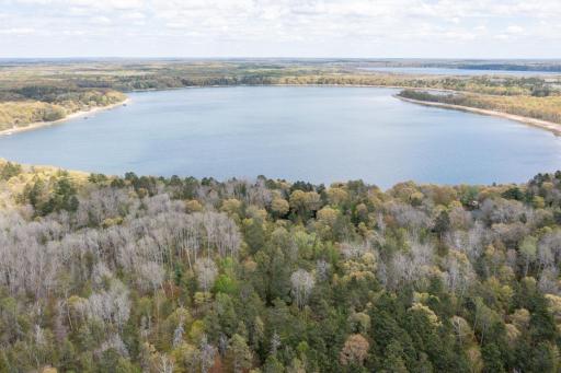 Aerial views showcase the propertyâs impressive 170 feet of shoreline and private wooded setting.