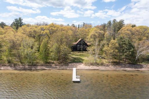 Exceptional Bass Lake property featuring 170 feet of pristine shoreline and over 3 wooded acres of privacy.