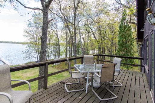 Spacious lakeside deck offers the perfect setting for entertaining, relaxing, and soaking in panoramic lake views.