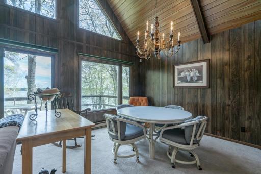 Large windows bring in natural light and showcase stunning lake views throughout the home.