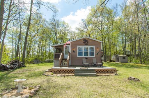 Extensively updated throughout with remodeled baths, updated flooring, newer appliances, and expanded lakeside deck.