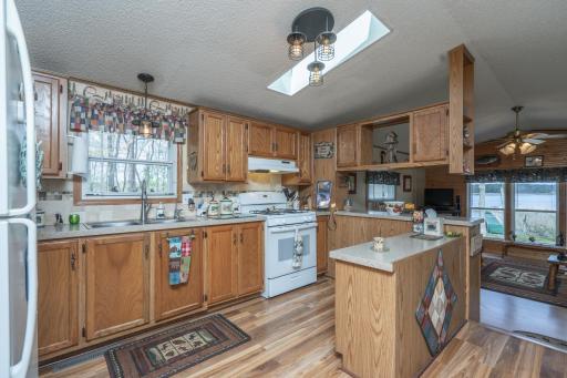 Updated kitchen featuring newer appliances, refreshed countertops, and plenty of space to gather.