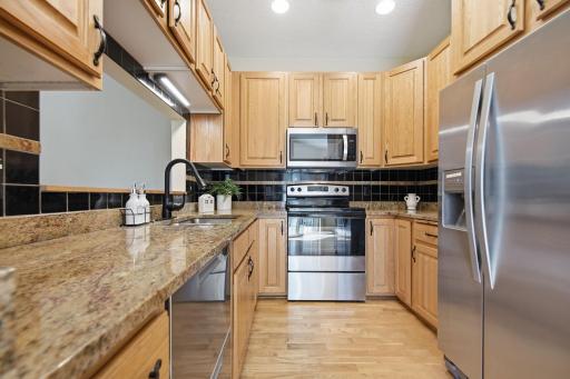 The kitchen is well-appointed... You'll love the great storage options in the tall upper cabinets.