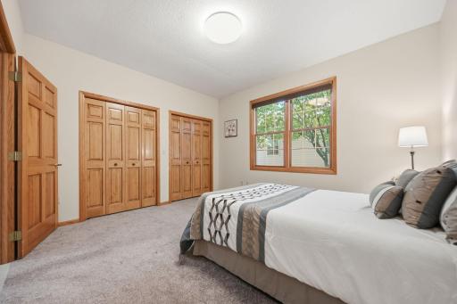 There's a full wall of closet storage behind the double closet doors.