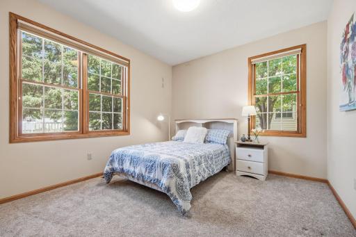 The second bedroom is also good sized and will easily adapt to any combination of furniture. Note: All of the window treatments in this home are custom fit and most are Hunter Douglas