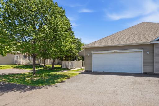 The two car garage is oversized... Note: Attic storage above garage and a wall of cabinet storage on one side of garage