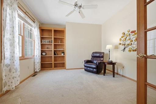 The den is located adjacent to the living room. Great space for overflow entertaining. This room could easily adapt with a few modifications to serve as a guest room, as well.