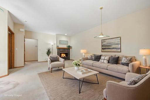While the current owners have used this area for a living/dining room, it would be easily adaptable (as shown by removing the dining table from the previous photo and virtually staging).