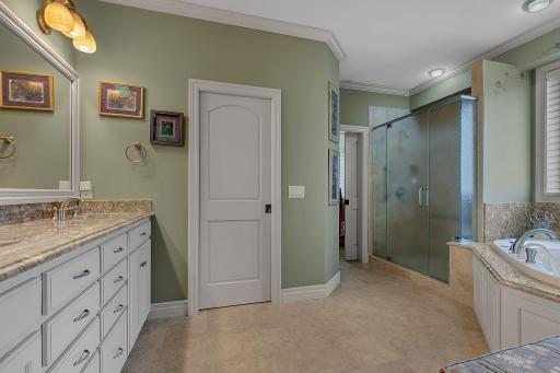 Private bathroom, steps into the walk in closet.