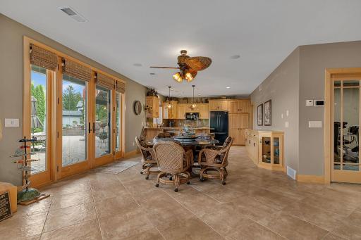 Doors providing you access to the back patio. Lower level and additional kitchenette is celebration central! Tiled floor makes for easy clean up when entertaining.