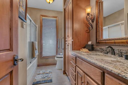 Full main floor bathroom with a surplus of options for storage.