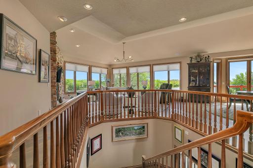 Windows on all sides capture beautiful views from every angle of the home. Grand open stairwell keeps the main floor open full of natural light at every angel.