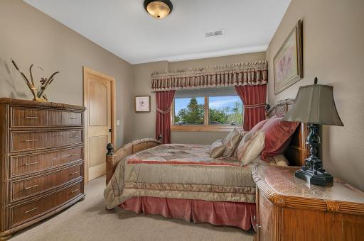Well-sized bedroom designed for everyday comfort and privacy. This bedroom connects to a walk thru bath.