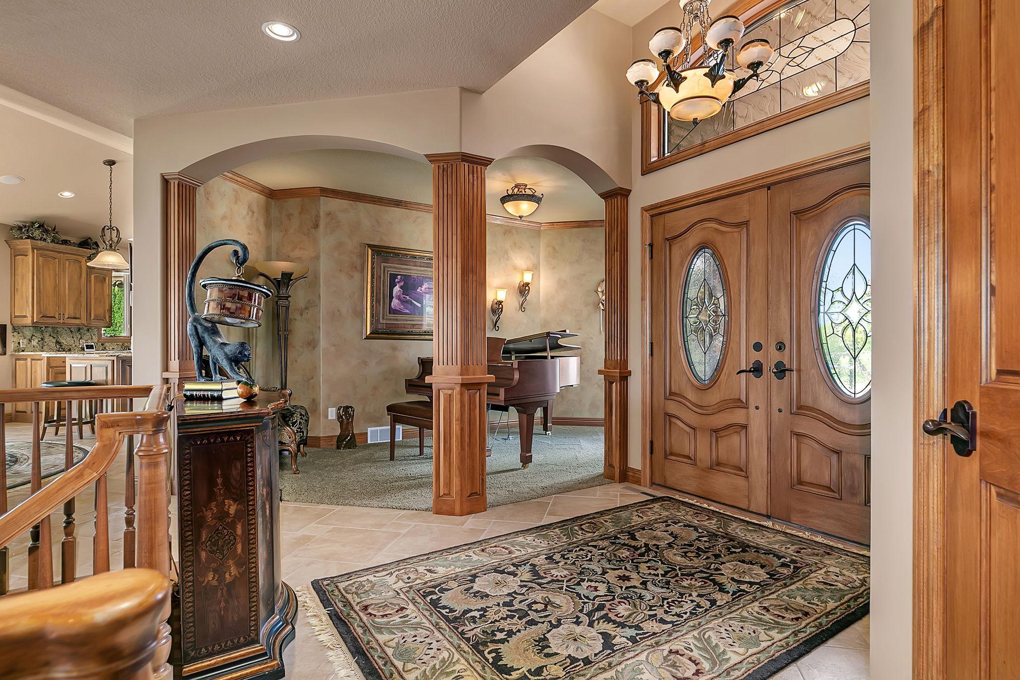 Front foyer is all the more decadent with a formal sitting room or as this seller utilizes as a dedicated music room.